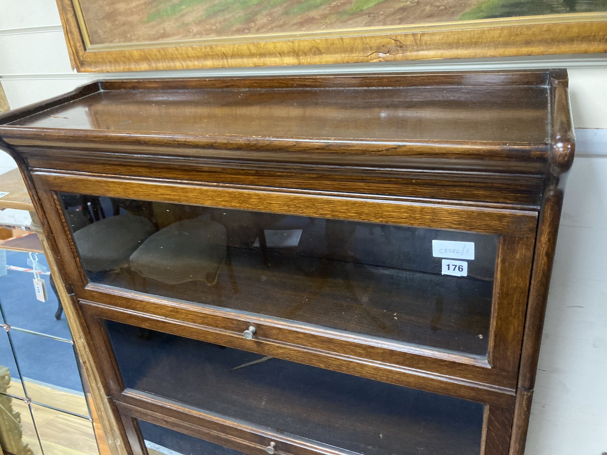 A Globe Wernicke style oak four section bookcase, width 88cm depth 30cm height 140cm